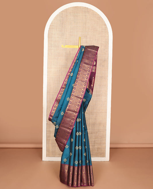 Blue zari buttas silk saree, contrast geometric border & pallu of floral & peacock designs
