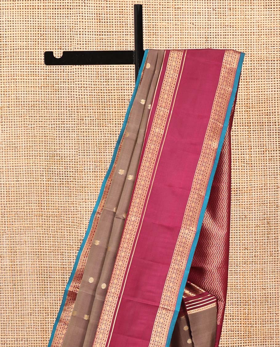 Brown Vasundhara Silk Mix Saree, Enriched with Zari Buttas All Over Its Body, Complemented by Contrast Varisai Pettu Border of Neli, Muthu, Star Kamalam, and Rudraksham Designs, Vanki Design Pallu, and Paired with a Contrast Blouse