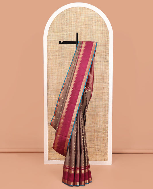 Brown Vasundhara Silk Mix Saree, Enriched with Zari Buttas All Over Its Body, Complemented by Contrast Varisai Pettu Border of Neli, Muthu, Star Kamalam, and Rudraksham Designs, Vanki Design Pallu, and Paired with a Contrast Blouse