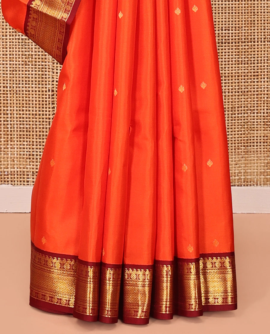 Orange Vasundhara Silk Saree, Enthralled with Zari Buttas All Over Its Body, Complemented by a Contrast Border of Manga, Poun, Neli, and Mayil Kann Designs, Grand Jaal Pallu, and Paired with a Contrast Blouse