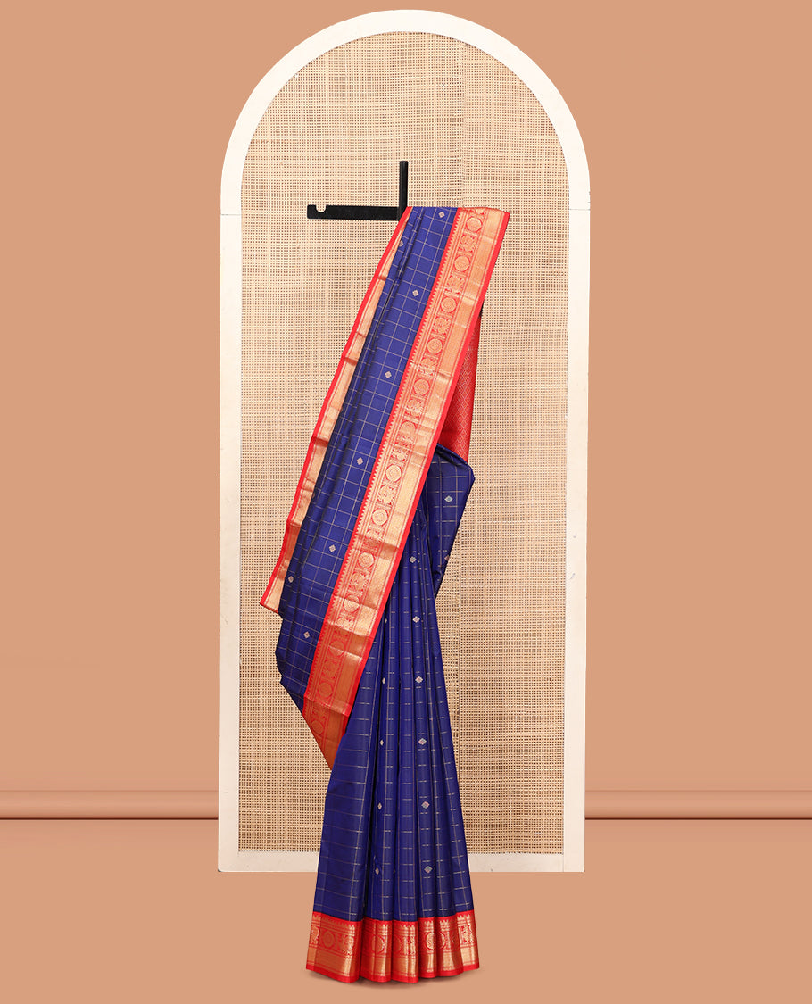 Blue Vasundhara Silk Saree, Adorned with Butta Enclosed Checks, Complemented by a Contrast Border of Mayil Chakram Designs, and a Contrast Blouse