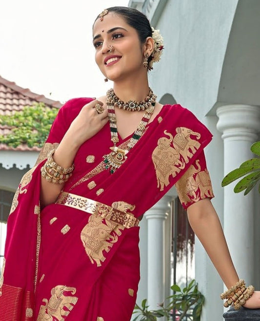 Red Designer Saree, Meticulously Crafted with Zari Buttas, Featuring a Self-Border Depicting a Herd of Elephants, Subtly Woven Pallu of Spare Stripes, and Paired with a Matching Blouse of Elephant Motifs