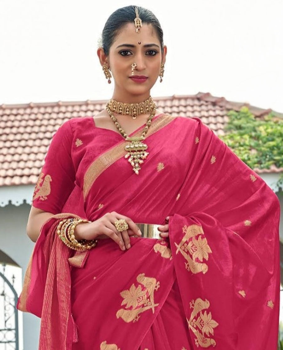 Light Red Designer Saree, Artfully Detailed with Zari Buttas, Featuring a Self-Border Depicting Parrot Motifs, Subtly Woven Pallu of Spare Stripes, and Paired with a Matching Blouse of Parrot Motifs