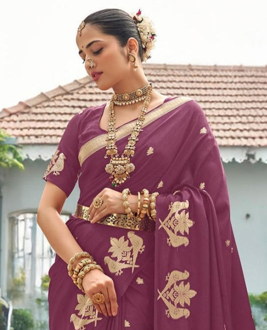Rosewood Pink Designer Saree Adorned with Zari Buttas, Featuring a Self-Border Depicting Parrot Motifs, Subtly Woven Pallu of Spare Stripes, and Paired with a Matching Blouse of Parrot Motifs