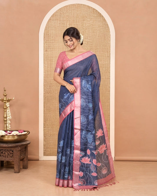 Blue Linen Cotton Saree, Artfully Detailed with Pichwai Lotus Motifs Printed on Its Body, Complemented by a Contrast Bavanji Border, Pallu Pictures Pichwai Lotus Motifs, and Paired with a Contrast Blouse