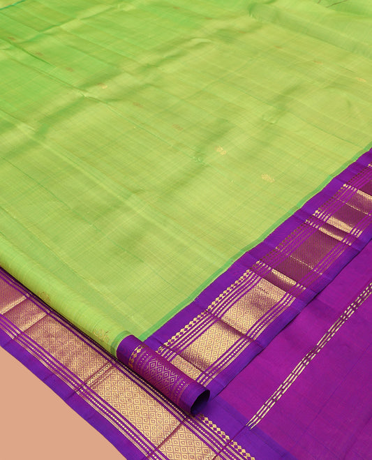 Green Kanchipuram Silk Saree, Delicately Woven with Zari Buttas, Complemented by a Contrast Korvai Border of Panner Sombu, Banaras, Muthu, and Mayil Kann Design, Pallu of Zari Design, and No Blouse