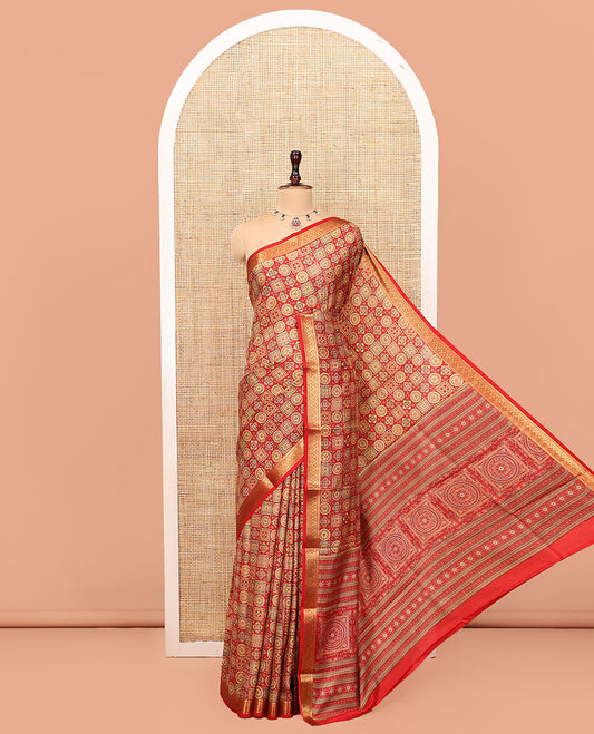 Red Printed Silk Saree, Gracefully Embellished with Geometric Prints, Highlighted by a Traditional Zari Border, Printed Pallu, and a Matching Blouse