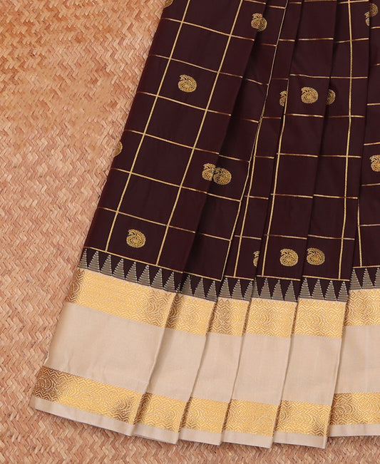 Brown Budget Silk Saree Elegantly Highlighted with Paisley Butta Enclosed Checks, Complemented by a Contrast Traditional Zari Motifs Temple Border, Gleaming Zari Pallu, and Paired with a Contrast Blouse