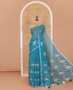 Peacock Pichwai lotus printed linen cotton saree, piping zari border, colorful tasselled lotus printed pallu, and a contrast lotus printed blouse