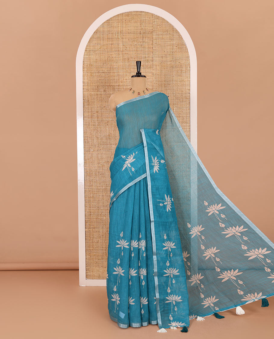 Peacock Pichwai lotus printed linen cotton saree, piping zari border, colorful tasselled lotus printed pallu, and a contrast lotus printed blouse