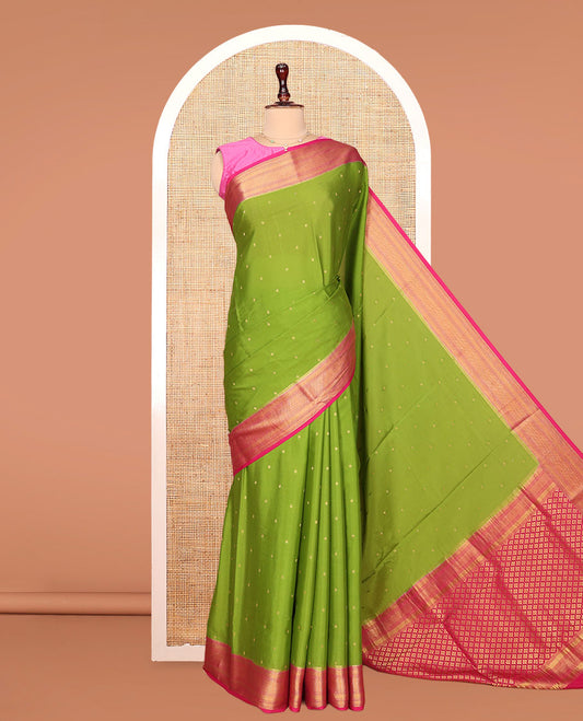 Green Mysore Silk Saree, Detailed with Zari Buttas All Over Its Body, Complemented by a Contrast Zari Border of Traditional Designs, Grandly Zari Decked Up Pallu of Jaal Designs, and Paired with a Contrast Blouse