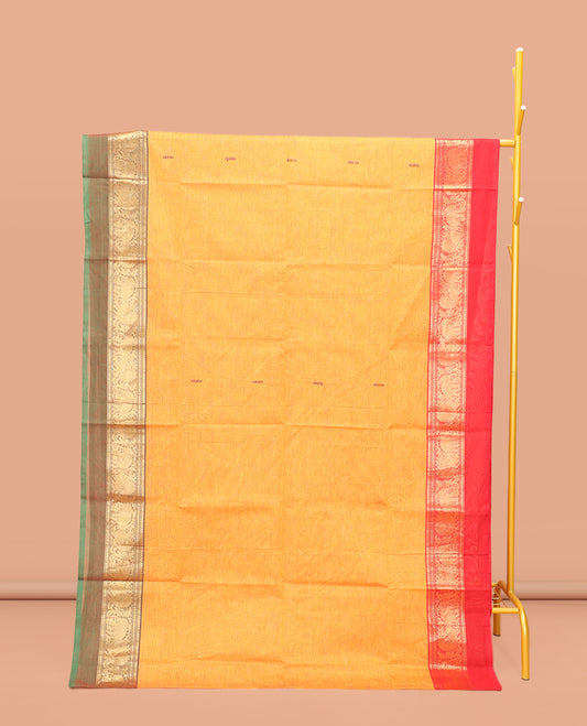 Yellow Chettinad Cotton Saree, Decked Up with Thread Buttas All Over Its Body, Complemented by a Contrast Ganga-Jamuna Kal Eragina Border of Kodi Peacock and Elephant Designs, Pallu of Buttas and Stripes, and Paired with a Matching Blouse