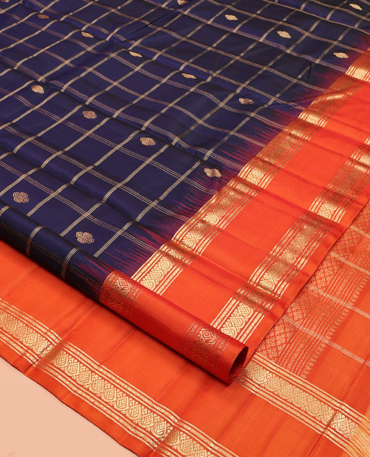 Blue Kanchipuram Silk Saree, Gleamed Up with Butta Enclosed Checks, Complemented by a Contrast Rettai Pettu Zari Border, Grand Pallu, and a Contrast Blouse
