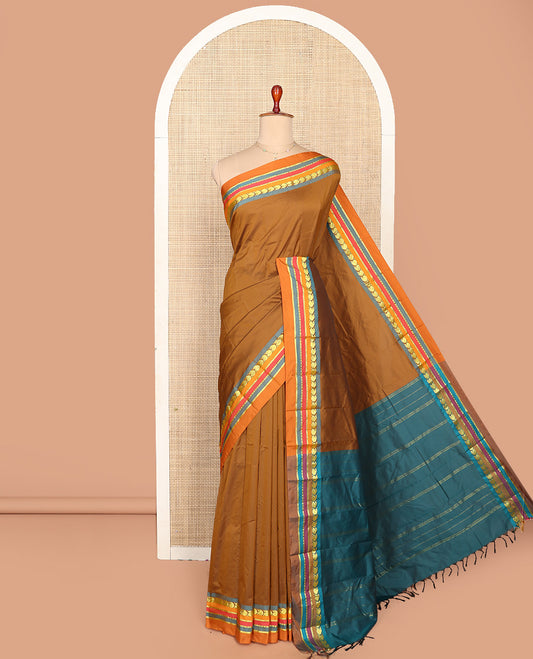 Brown Plain Aarani Silk Saree, Complemented by a Contrast Traditional Zari Design Border, Zari Striped Pallu, and Paired with a Contrast Blouse