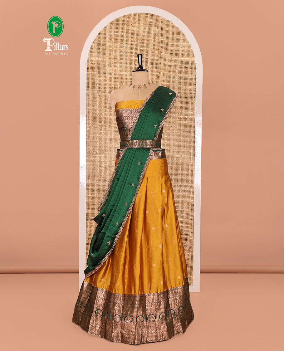 Yellow and Green Semi-Banarasi Half-Saree Prettified with Zari Buttas on Its Skirt, Complemented by a Contrast Traditional Zari Design Steeped Border, Paired with a Matching Blouse, and a Satin Georgette Embroidered Scallop Dhavani