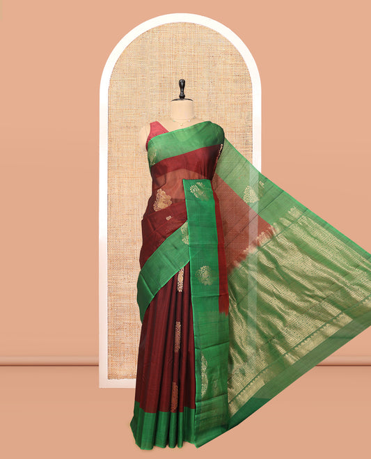 Maroon Cotton Saree, Highlighted by a Zari Leaf Motifs, a Contrast by a Zari Motif Border, a Geometric Pattern Pallu, and a Contrast Blouse