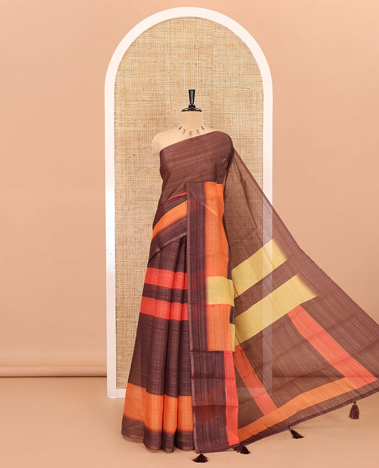 Brown horizontally striped linen cotton saree, contrast plain border, checks and striped pallu, and a horizontal striped blouse