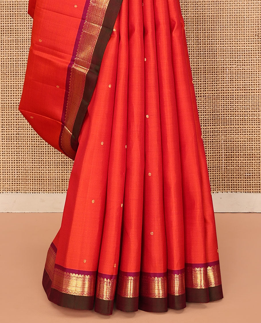 Orange Kanchipuram Silk Saree, Graced with Zari Buttas All Over Its Body, Complemented by Contrast Border of Rekku, Banaras, Neli, and Geometric Designs, Pallu of Traditional Designs, and Paired with a Contrast Blouse