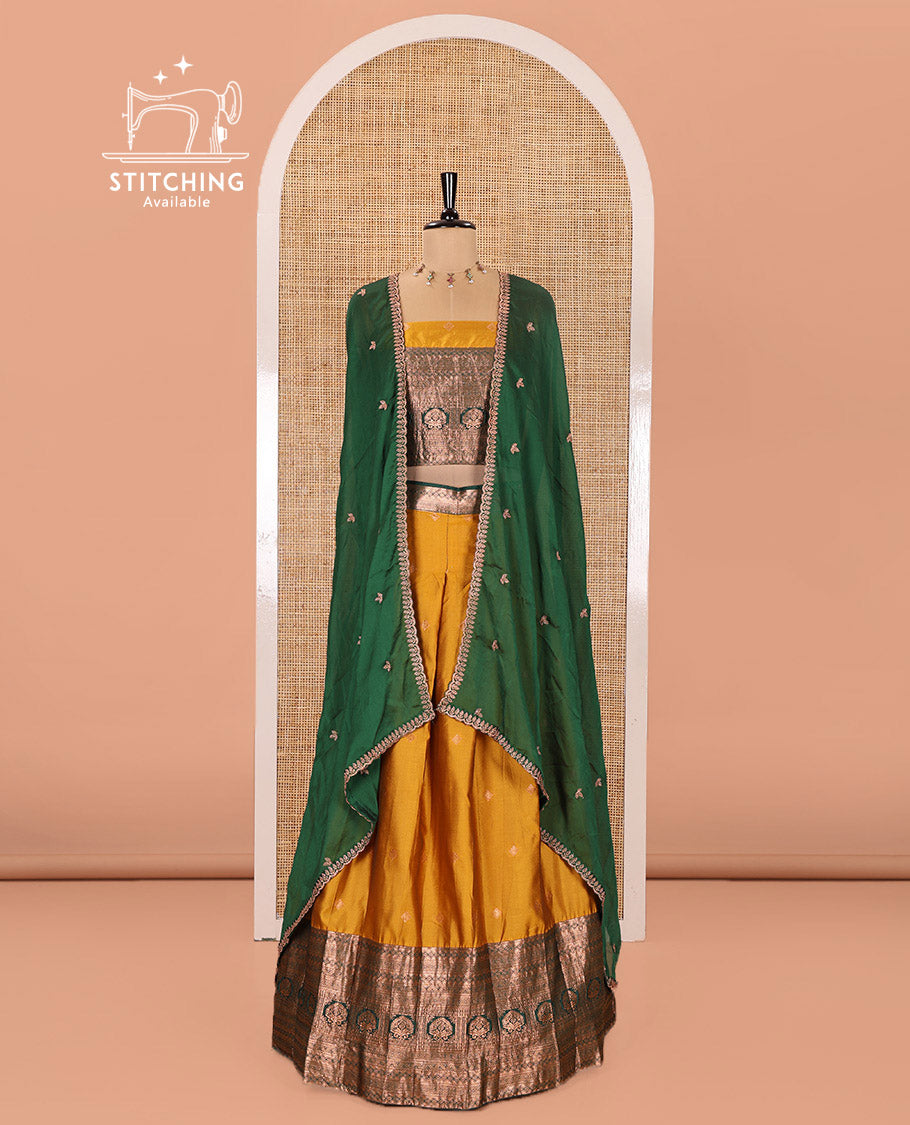 Yellow and Green Semi-Banarasi Half-Saree Prettified with Zari Buttas on Its Skirt, Complemented by a Contrast Traditional Zari Design Steeped Border, Paired with a Matching Blouse, and a Satin Georgette Embroidered Scallop Dhavani