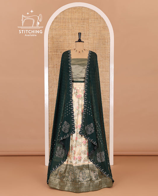 Cream and bottle green half-saree, floral and bird printed nylon viscose crepe top, contrast traditional zari and stone work border, jacquard banaras blouse, and scallop stone work dhavani