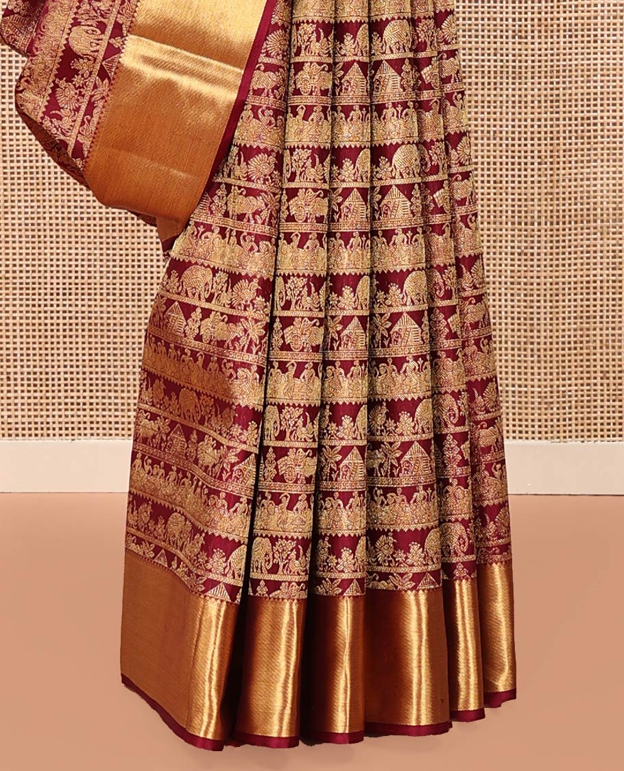 Maroon Kanchipuram Wedding Silk Saree, Artfully Woven with Warli Village Theme Motifs in Jacquard Weave, Highlighted by Thick Zari Border, Grand Jaal Pallu and Paired with a Matching Blouse