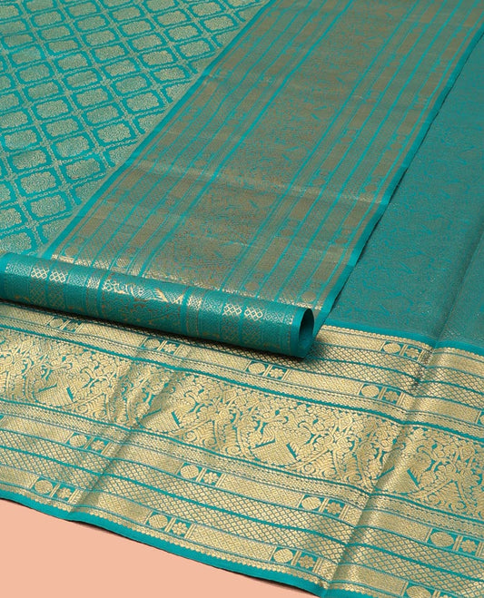 Blue Kanchipuram Wedding Silk Saree, Finely Crafted with Jacquard Design on Its Body, Highlighted by Zari Border of Mayil Kann, Rudraksham, Kamalam, and Iruthalai Pakshi Designs, Intricately Designed Pallu, and Paired with a Matching Blouse