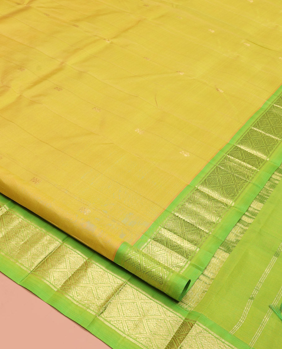 Green Kanchipuram Silk Saree, Graced with Zari Buttas, a Contrast One-Sided Jaal Design Zari Border, Zari-Woven Pallu, and No Blouse