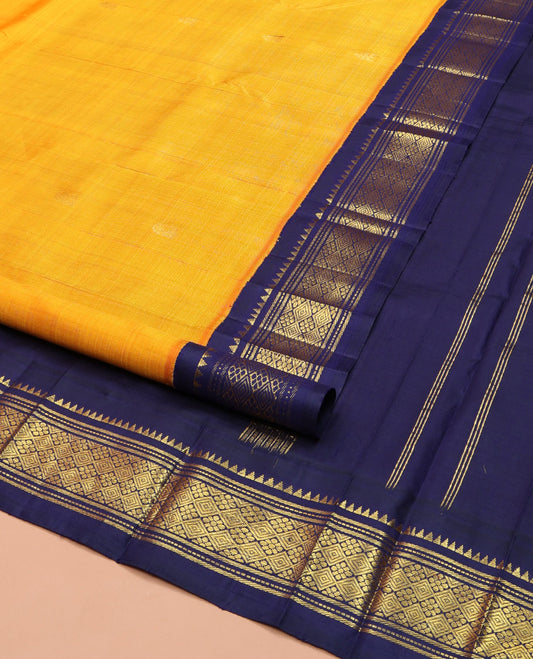 Yellow Kanchipuram Silk Saree, Sparsely Woven with Zari Buttas on Its Body, Complemented by a Contrast One-Sided Korvai Border of Rekku, Muthu, Banaras, and Jaal Designs, Pallu Features Zari Designs, and Comes Without a Blouse