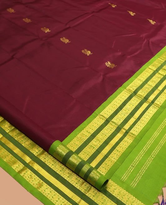 Maroon Kanchipuram Silk Saree, Graced with Zari Buttas, a Contrast Korvai One-Sided Border of Rekku, Rudraksham, Neli, and Mayil Design, Zari Design Pallu, and No Blouse