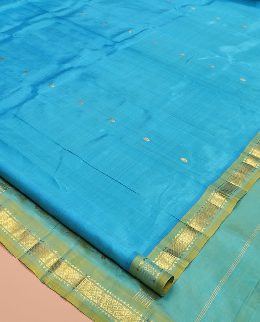 Blue Kanchipuram Silk Saree, Woven with Zari Buttas, Complemented by Contrast One-Sided Border of Rekku, and Mayil Kann Designs, Zari Design Pallu, and No Blouse