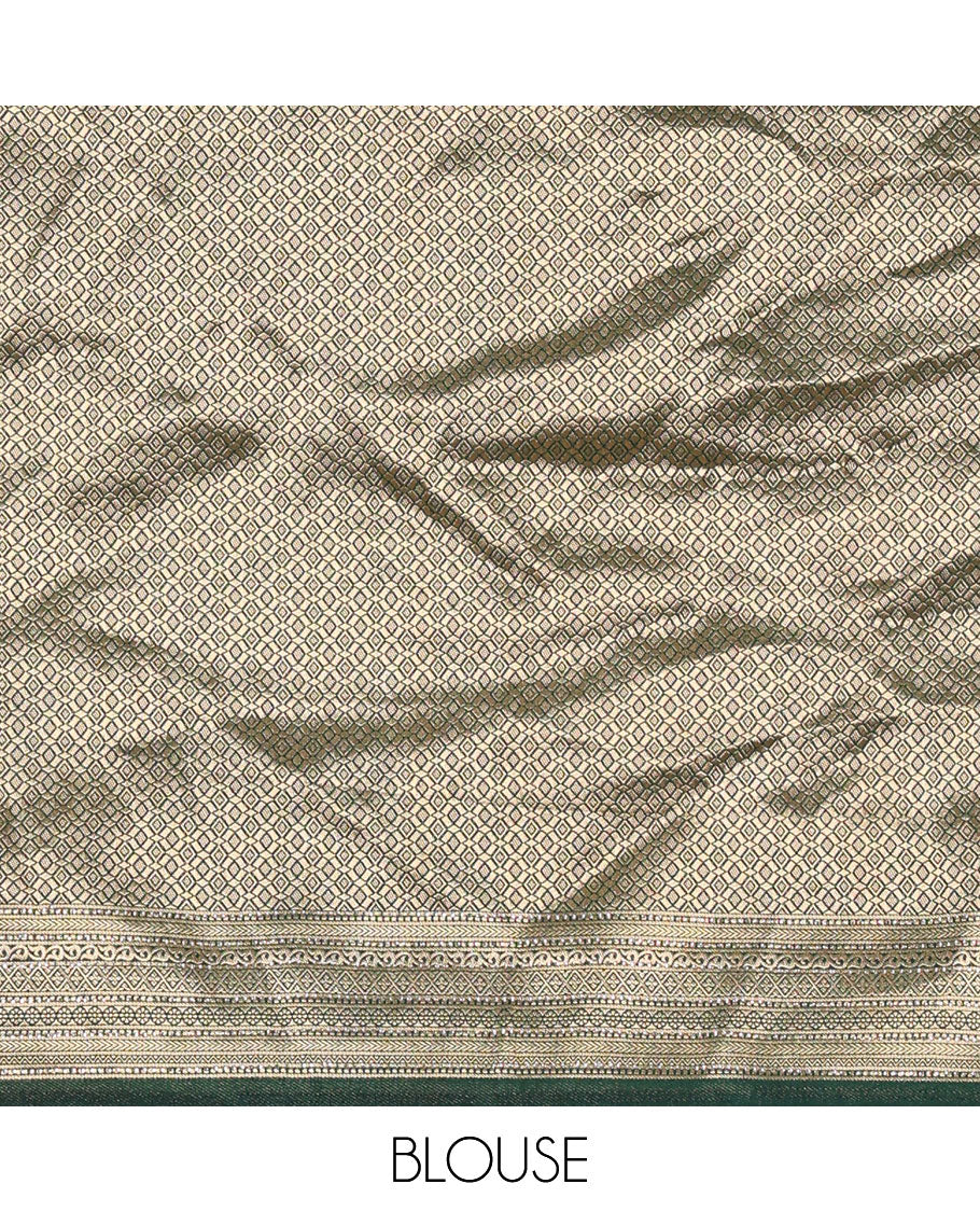 Cream and bottle green half-saree, floral and bird printed nylon viscose crepe top, contrast traditional zari and stone work border, jacquard banaras blouse, and scallop stone work dhavani