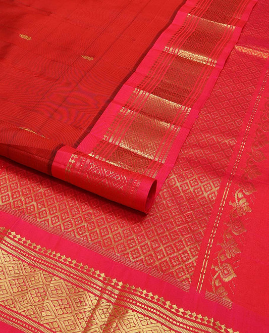 Red buttas kancheepuram silk saree with contrast border of thilakam mokku, banaras, muthu designs & zari design pallu