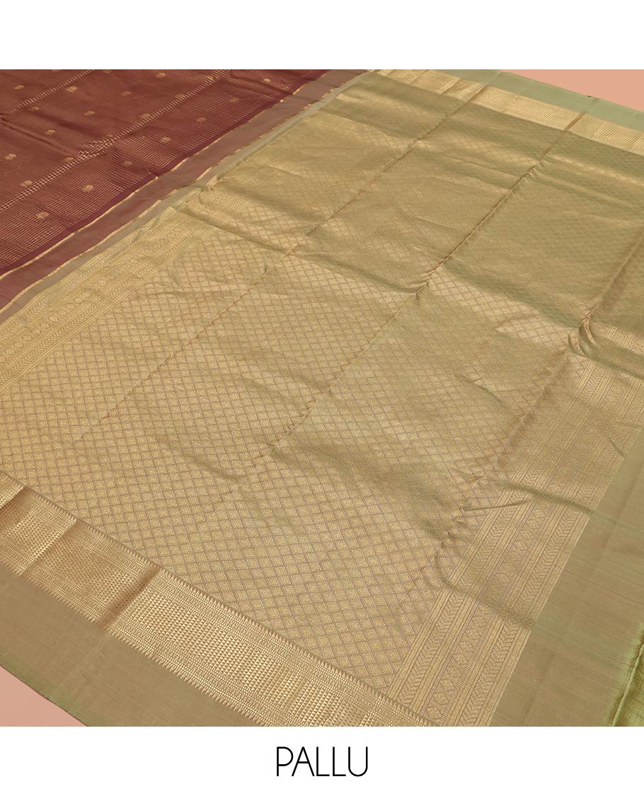 Brown Vasundhara Silk Saree, Prettified with Zari Buttas and Checks All Over Its Body, Complemented by a Contrast Kal Eragina Border of Ara Bogudi, Muthu, and Ara Maadam Designs, Grand Jaal Pallu, and Paired with a Contrast Blouse