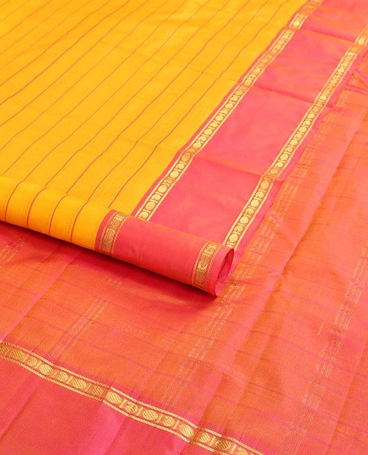 Orange striped kancheepuram silk saree with contrast rettai pettu border of banaras, paun design & zari design pallu
