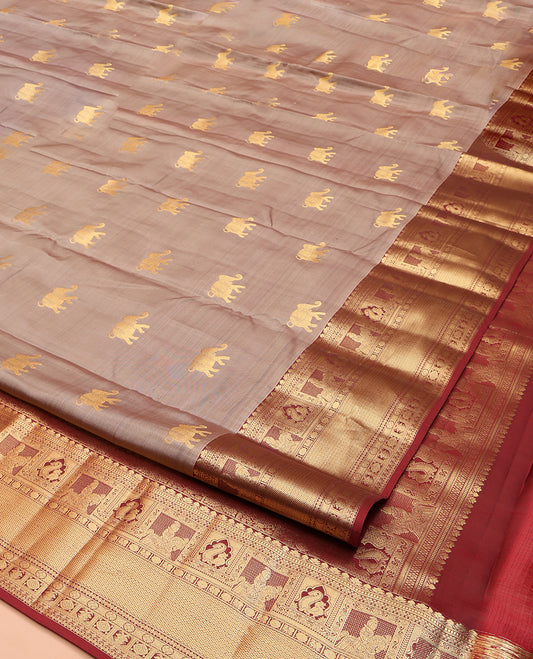 Grey Vasundhara Lite Silk Mix Saree, Artfully Detailed with Yaanai Buttas on Its Body, Complemented by a Contrast Border of Muthu, Kamalam, Mayil, Poun, Vanki, and Poikkal Kuthirai Designs, Intricate Pallu, and Paired with a Contrast Blouse