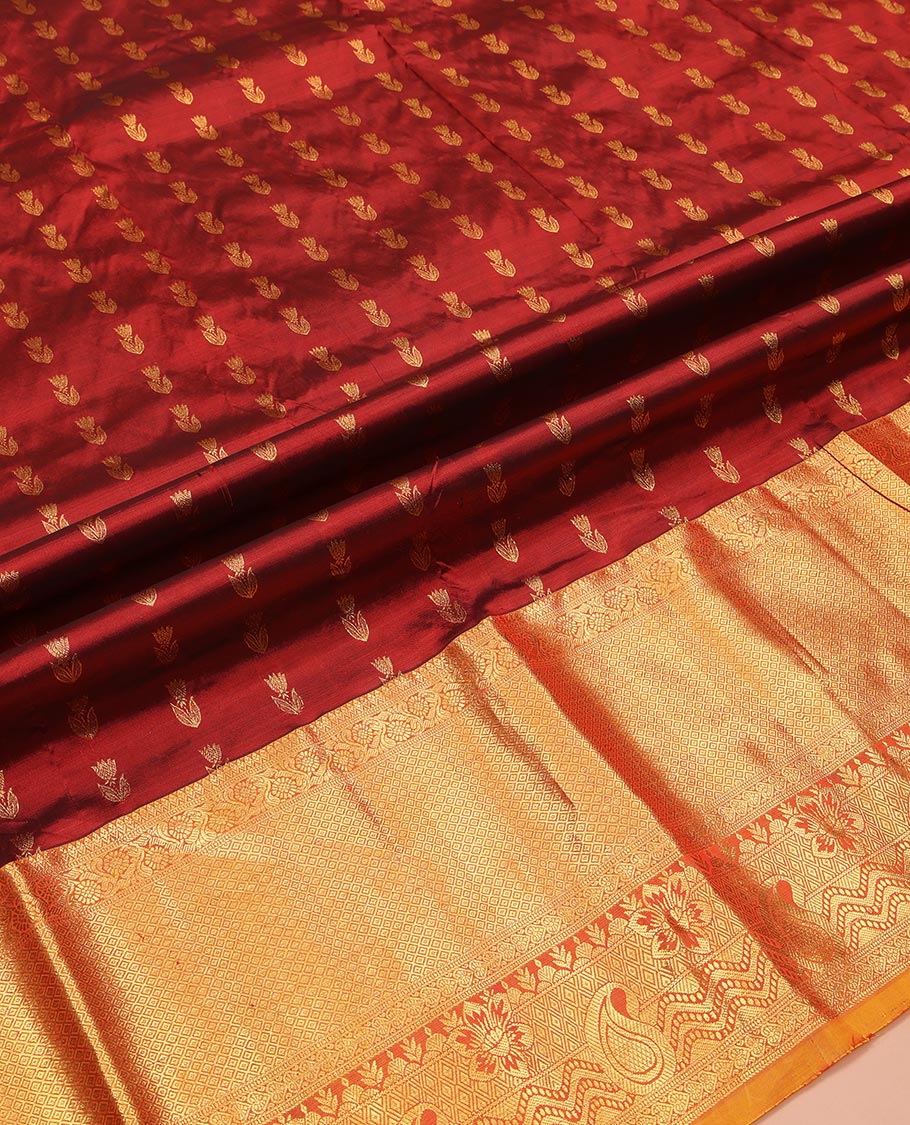 Maroon Pure Silk Half-Saree, Delicately Woven with Zari Buttas All Over Its Skirt, Complemented by a Contrast Border of Jaal, Floral, and Paisley Designs, Paired with a Contrast Blouse, and Comes with a Jaal Design Dhavani