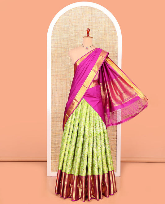 Green Pure Silk Half-Saree Artfully Detailed with Jacquard Design on Its Skirt, Complemented by a Contrast Border Featuring Rekku, Muthu, Kathir, and Mayil Kann Designs, Comes with a Contrast Jacquard Blouse and a Dhavani of Geometric Zari Designs