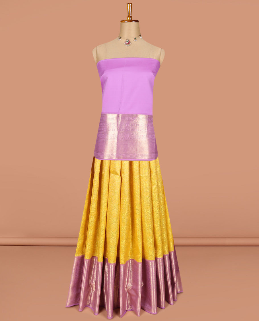 Yellow pure silk half-saree,  jacquard skirt, contrast border of thilakam mokku,banaras, mayil kann,cross kamalam, and then kuli kann , contrast zari blouse, and zari design dhavani