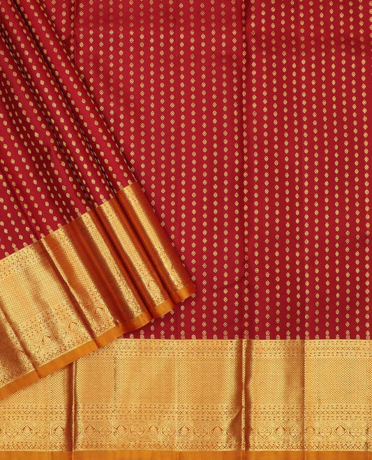 Maroon pure-silk half-saree, zari buttas with contrast traditional zari bordered skirt, zari design blouse, and a mat textured dhavani