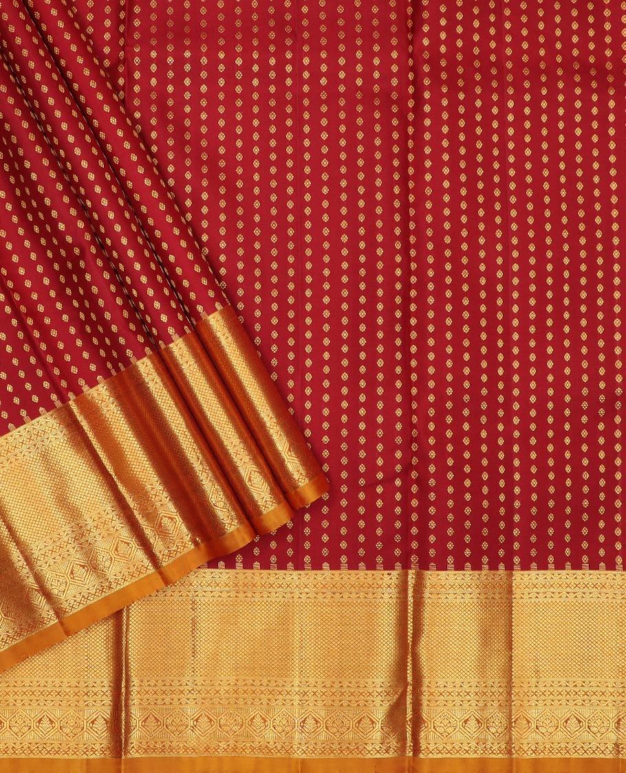 Maroon pure-silk half-saree, zari buttas with contrast traditional zari bordered skirt, zari design blouse, and a mat textured dhavani