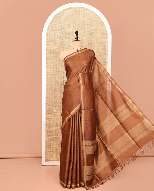 Brown Plain Tussar Silk Saree, a Piping Border, Self-Pallu of Stripes, and Matching Blouse
