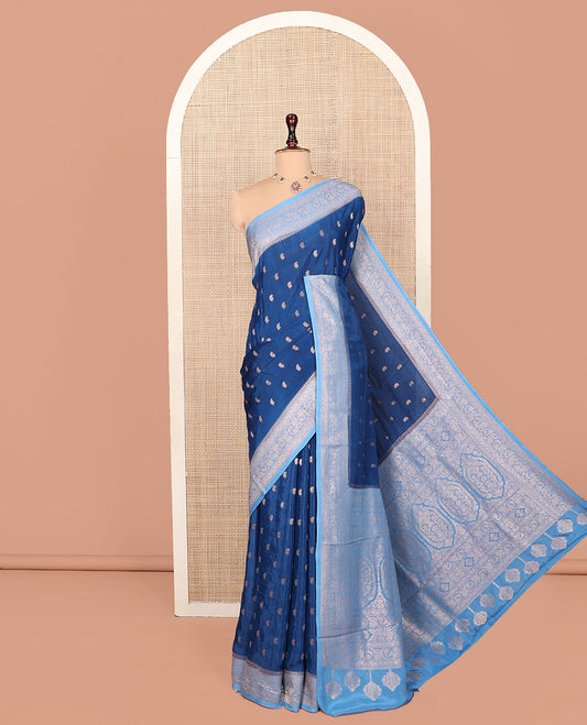 Blue Fancy Crepe Saree, Graced with Buttas, Complemented by a Contrast Floral Border, Intricately Designed Pallu, and a Contrast Blouse