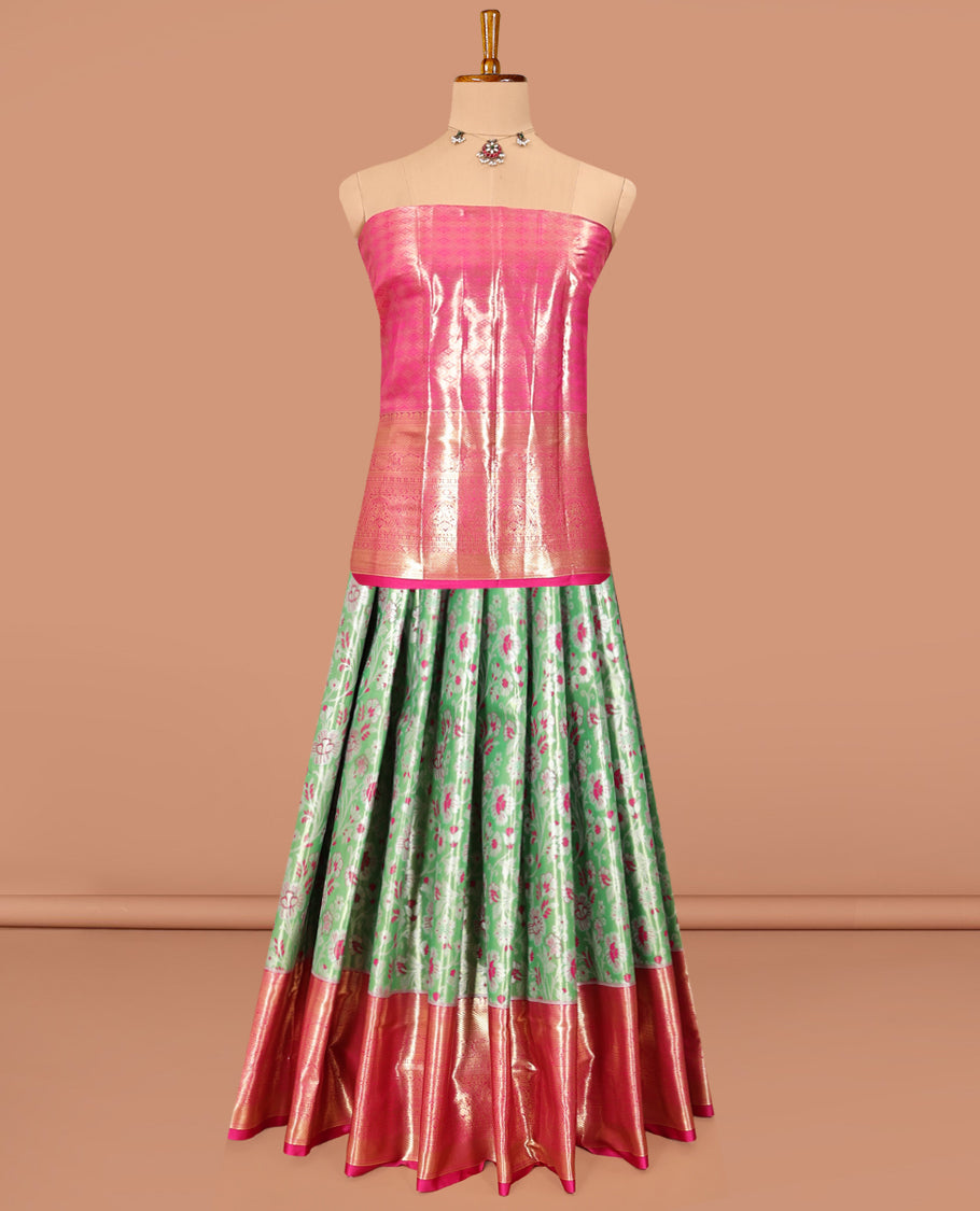 Green Art Silk Material Half Saree, Spotlighted with Jacquard Skirt, a Contrast Traditional Zari Border, Contrast Blouse, and an Intricate Dhavani