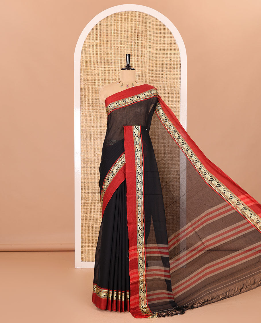 Black plain mercerised cotton saree, contrast kal erangina thread border of elephant motifs, striped pallu, and a matching blouse