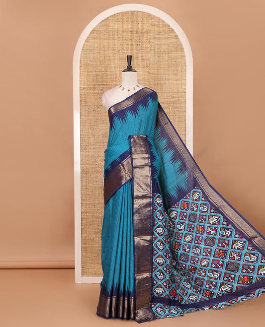 Blue striped dola-tussar saree, contrast temple zari border, patola animal motifs enclosed jaal printed pallu & patola printed blouse