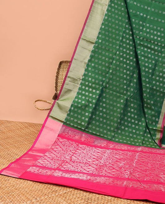 Green kupadam cotton saree with buttas, plain border & contrast pallu of intricate zari designs