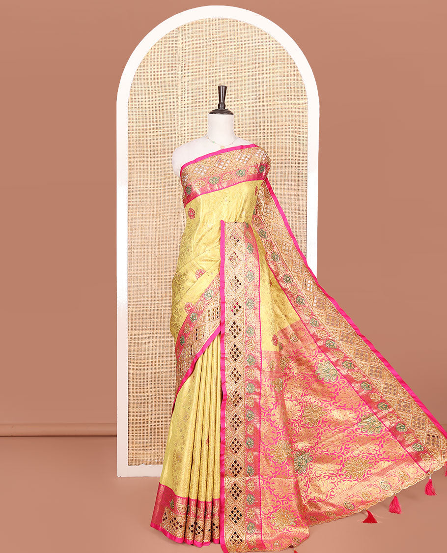Yellow Vastrakala Silk Saree, Highlighted with Jacquard and Embroidery Work, Complemented by Contrast Zari and Cut Embroidered Border, Gleaming Floral Jaal Stone Work Pallu, and Paired with Contrast Heavy Embroidered Blouse