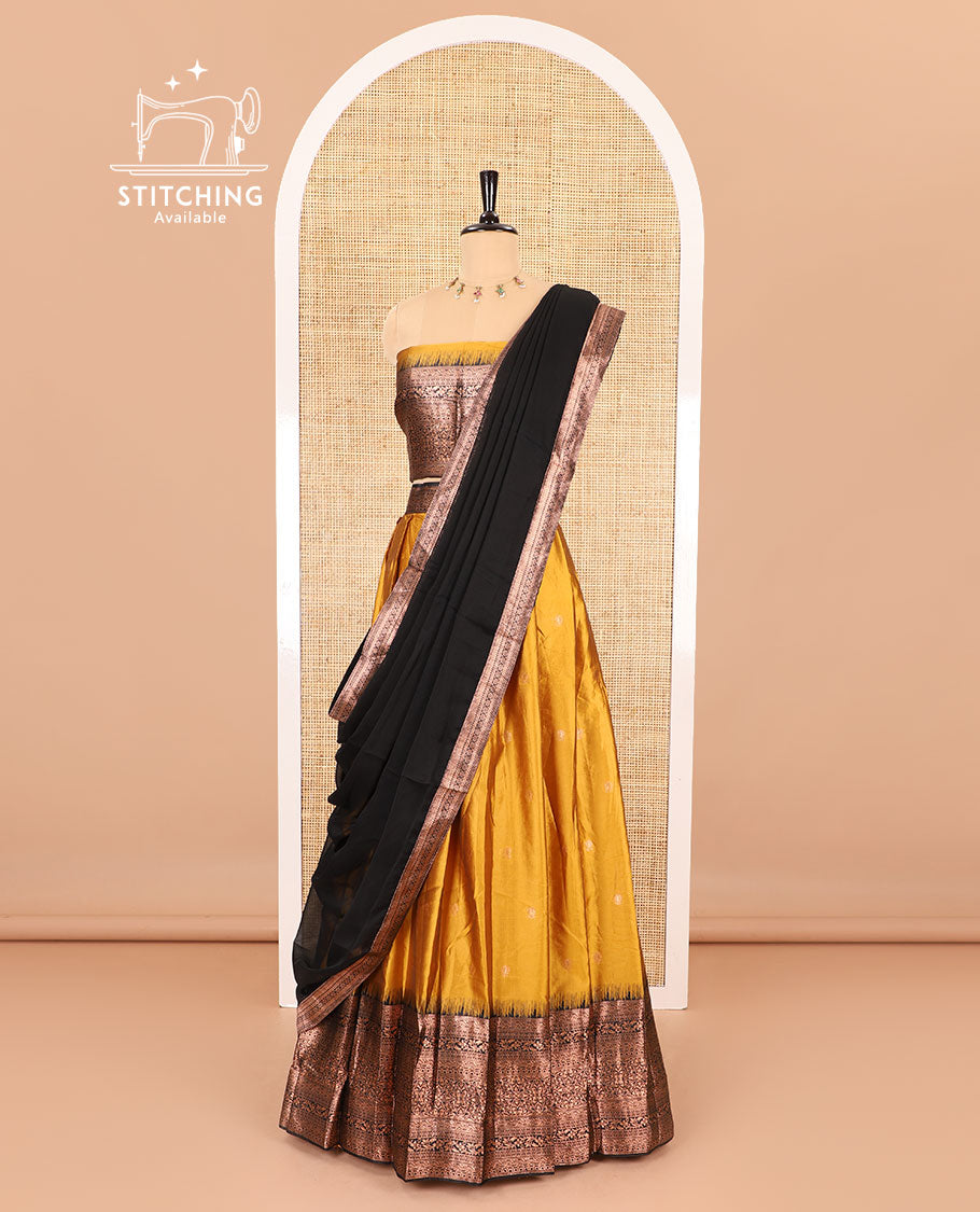 Yellow half-saree, zari buttas with contrast traditional zari bordered skirt, matching blouse and a contrast zari border dhavani