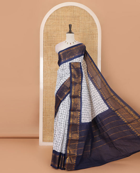 White Tamil letters printed Sungudi cotton saree, contrast traditional zari temple border, striped pallu & contrast plain blouse