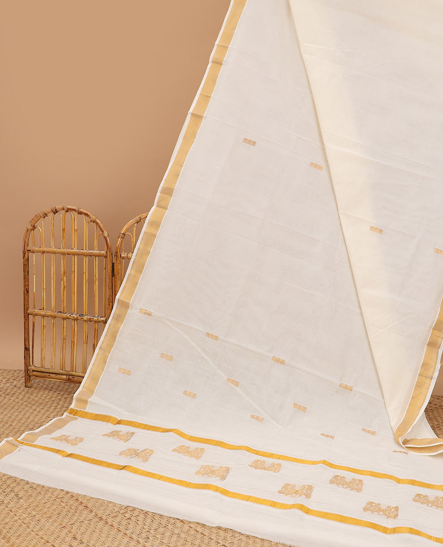 Cream kerala saree, zari border & pallu of peacock zari designs